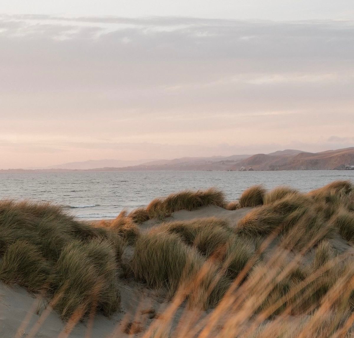 Soft coastal waves at sunrise